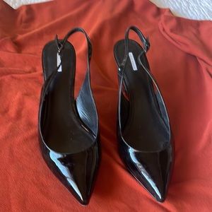 Vera Wang Black Patent leather 3” heels open with ankle strap.